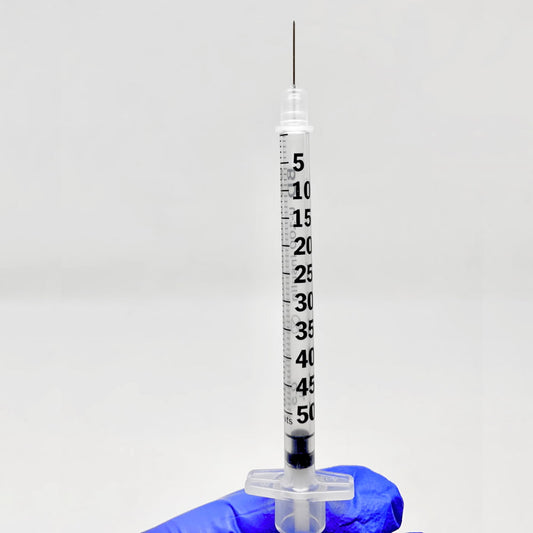 BD syringe with attached needle